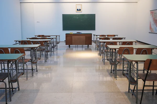 Classroom with rows of student desks and chairs