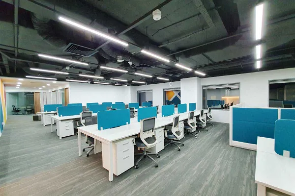 Open-plan office workstations by Riddhi Design